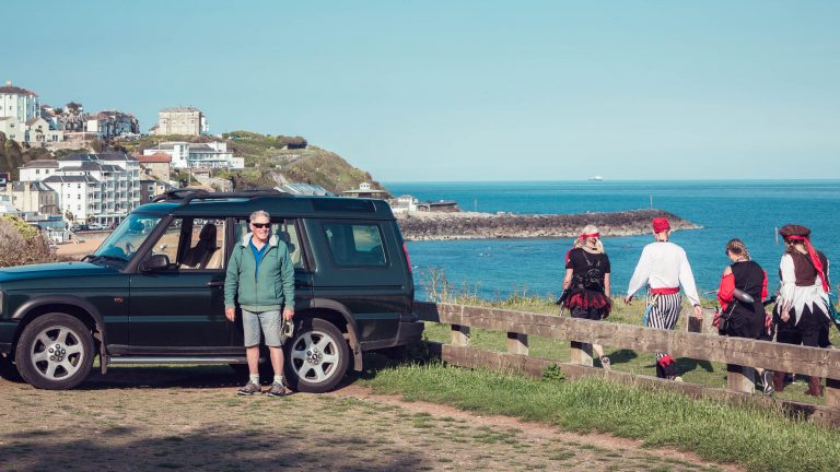 Steve Stevens stands with the 4x4 that he drove halfway around the World, on the cliff at Ventnor on the Isle of Wight