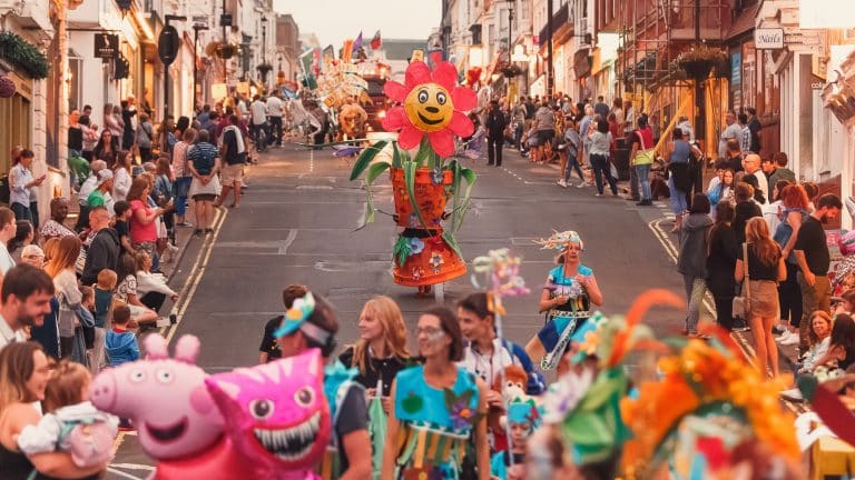 A shot of New Carnival Committee's giant flower pot plant. The shot has been taken looking up Union Street during Ryde Carnival 2022