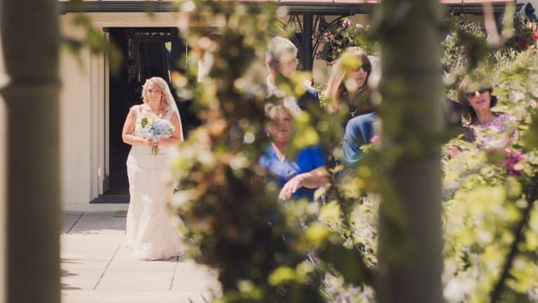 Gemma walking down the aisle to her husband to be Jake at their wedding. Albert Cottage, East Cowes. Isle of Wight.